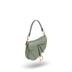 Eine grüne Handtasche mit goldener Hardware der Marke Dior.