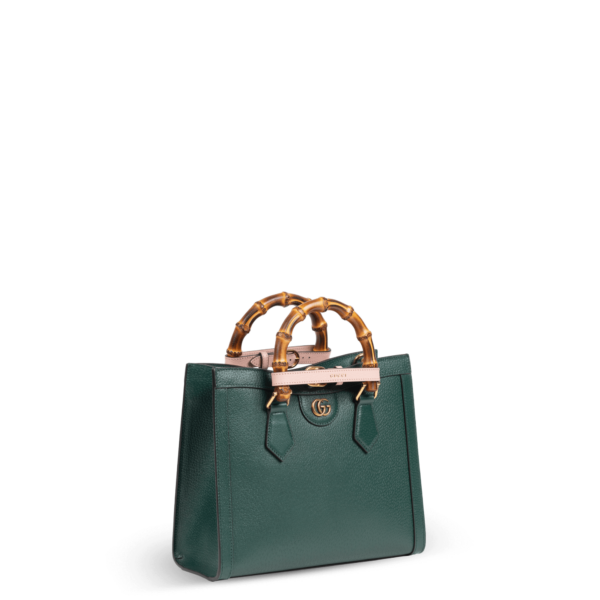 Dunkelgrüne Handtasche aus Leder mit Bambusgriffen der Marke Gucci.